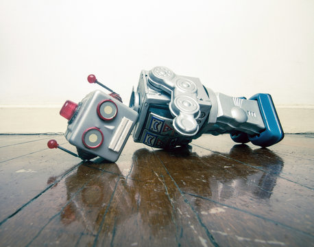 vintage bot lost his head on a old wooden floor