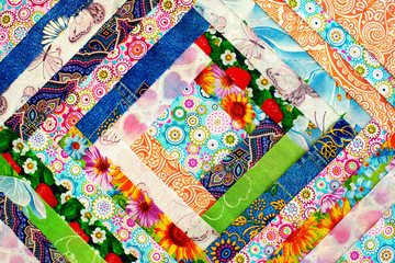 Cotton fabric folded in the shape of a square. View from above. Colorful cotton fabric for sewing clothes or bed linen.