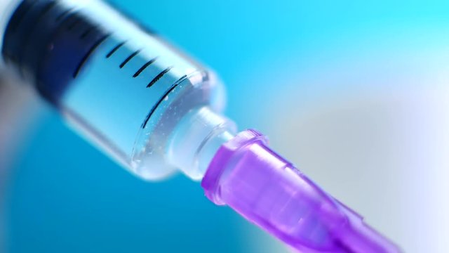 Doctors with syringe, injection in hospital. Russia coronavirus vaccine, Sputnik V. Covid-19 vaccination concept