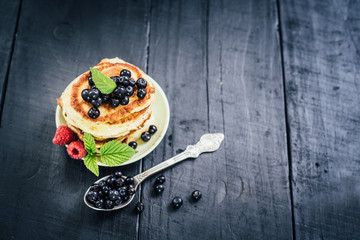 Sweet pancakes with blueberry. Copy space