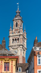 Fototapeta na wymiar Lille, old facades in the center, the belfry of the Chambre de Commerce in background 