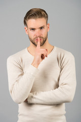 Keep silence. Man handsome attractive silence gesture. You better keep our secret. Being entrusted...