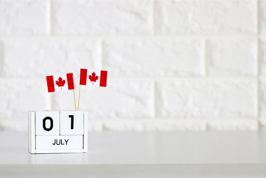 July 01 Wooden calendar and Canada Flag Concept Canada national day with space for your text