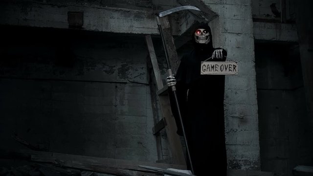 death with a scythe raises a sign with the inscription game over