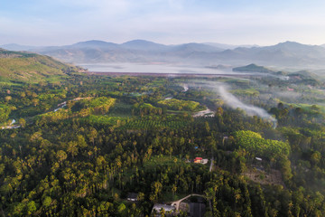 Fototapeta premium Village in tropical forest with canal river morning sunrise