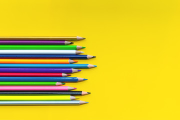 Teamwork concept. group of color pencil on yellow background with word Teamwork, Together, Everyone, Achieves and More