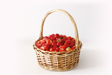 big basket of delicious ripe strawberries on white background