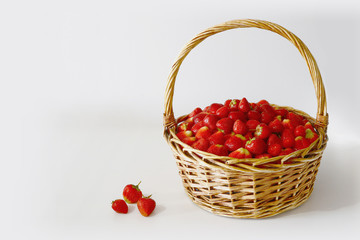 big basket of delicious ripe strawberries on white background