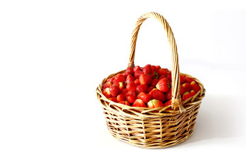 Fototapeta na wymiar big basket of delicious ripe strawberries on white background