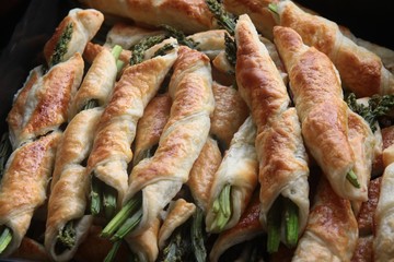 green sprouts of asparagus in dough