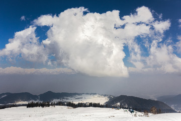 Clouds with snow in ski Himalaya mountains