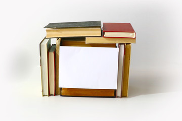 frame for message from a pile of books on a light background