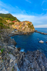 Manarola - Village of Cinque Terre National Park at Coast of Italy. Beautiful colors at sunset. Province of La Spezia, Liguria, in the north of Italy - Travel destination and attractions in Europe.