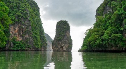 Fototapeta na wymiar Small rock between Big Rocks in Phang Nga Bay