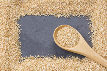 Raw amaranth seeds in wooden spoon - Amaranthus.