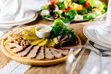 Tasty meat set: beef slices, bacon, smoked ears, pickles and sau