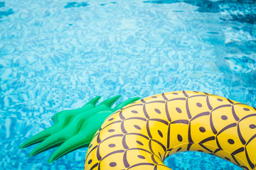 Life ring pineapple In the pool summer
