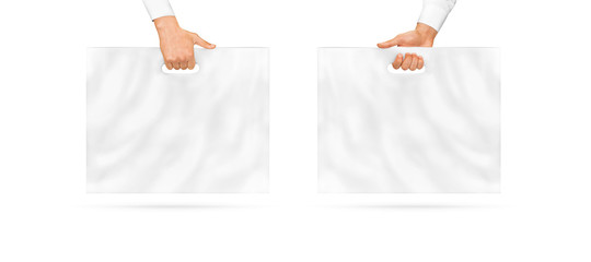 Blank large plastic bag mock up holding in hand, isolated. Empty polyethylene package mockup. Food...