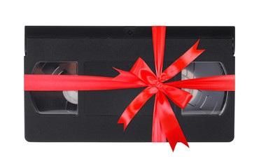 Videotape VHS gift tied red bow. Isolated