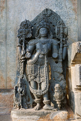 Close up of dwarapala on the right side of the North entrance, Hoysaleshvara Temple, Halebid, Karnataka
