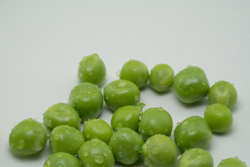 Fresh harvest green peas from my garden on white background 