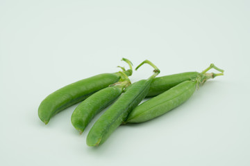 Fresh harvest green peas pods from my garden on white background 