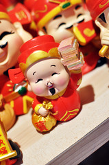 Chinese Deity God Of Wealth holding a bag of money