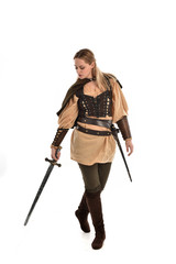 full length portrait of girl wearing brown medieval costume,. standing pose, isolated on white studio background.