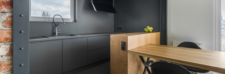Gray kitchen with table