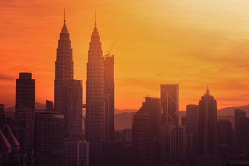 Cityscape of Kuala Lumpur city skyline at sunrise in Malaysia.