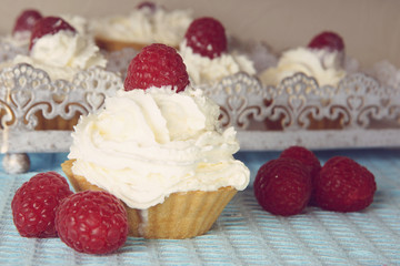 Preparing for the holiday, homemade cakes with raspberries and cream