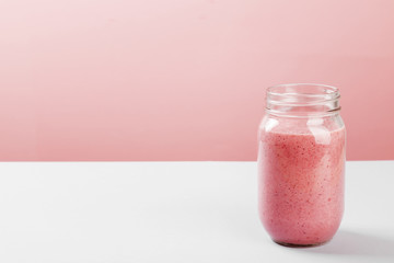 Strawberry smoothies on a pink background. Copy space. Food background