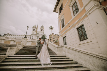 Young wedding couple on Spanish stairs in Rome