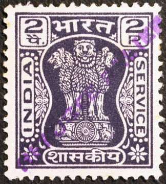 Three statues of lions on indian vintage postage stamp