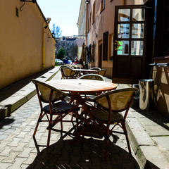 Street cafe or restaurant in the European city. Chairs and table