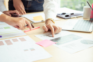 Bussiness concept working discussing the charts and graphs showing the results of their successful teamwork.