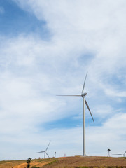 Fototapeta premium Landscape Wind turbines generating electricity with blue sky and mountain