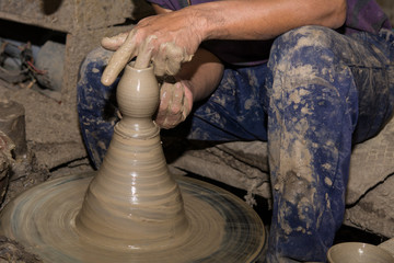 Hands of Professional Thai man using mechanic pottery made earthenware at 