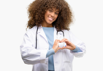 African american doctor woman, medical professional working happy showing love with hands in heart shape expressing healthy and marriage symbol - Powered by Adobe