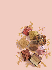 set of decorative cosmetics on a pink background