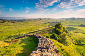 Fototapeta na wymiar Hadrian's Wall near Caw Gap / Hadrian's Wall is a World Heritage Site in the beautiful Northumberland National Park. Popular with walkers along the Hadrian's Wall Path and Pennine Way