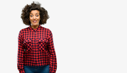 Beautiful arab woman confident and happy with a big crazy smile laughing