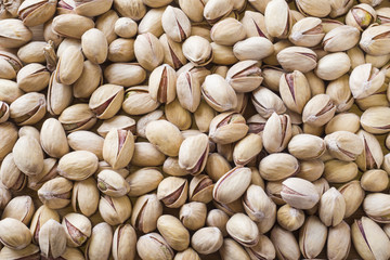 Salty pistachios nuts Background of the full population