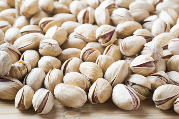 Salty pistachios nuts Background of the full population