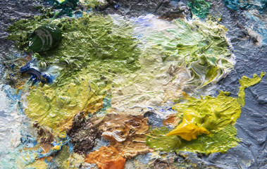 Oil paint is colorful and textured, bright background, top view