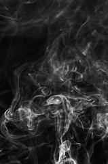 abstract fragment movement of white smoke on black background.