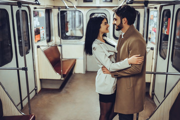Young romantic couple in subway