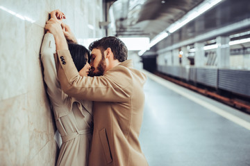 Young romantic couple in subway