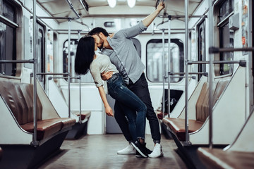 Young romantic couple in subway