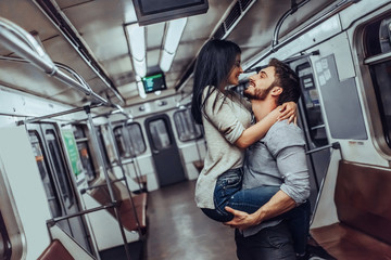 Young romantic couple in subway